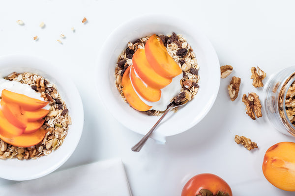 Low carb breakfast on the go: bowls of yogurt with fruit and low carb granola